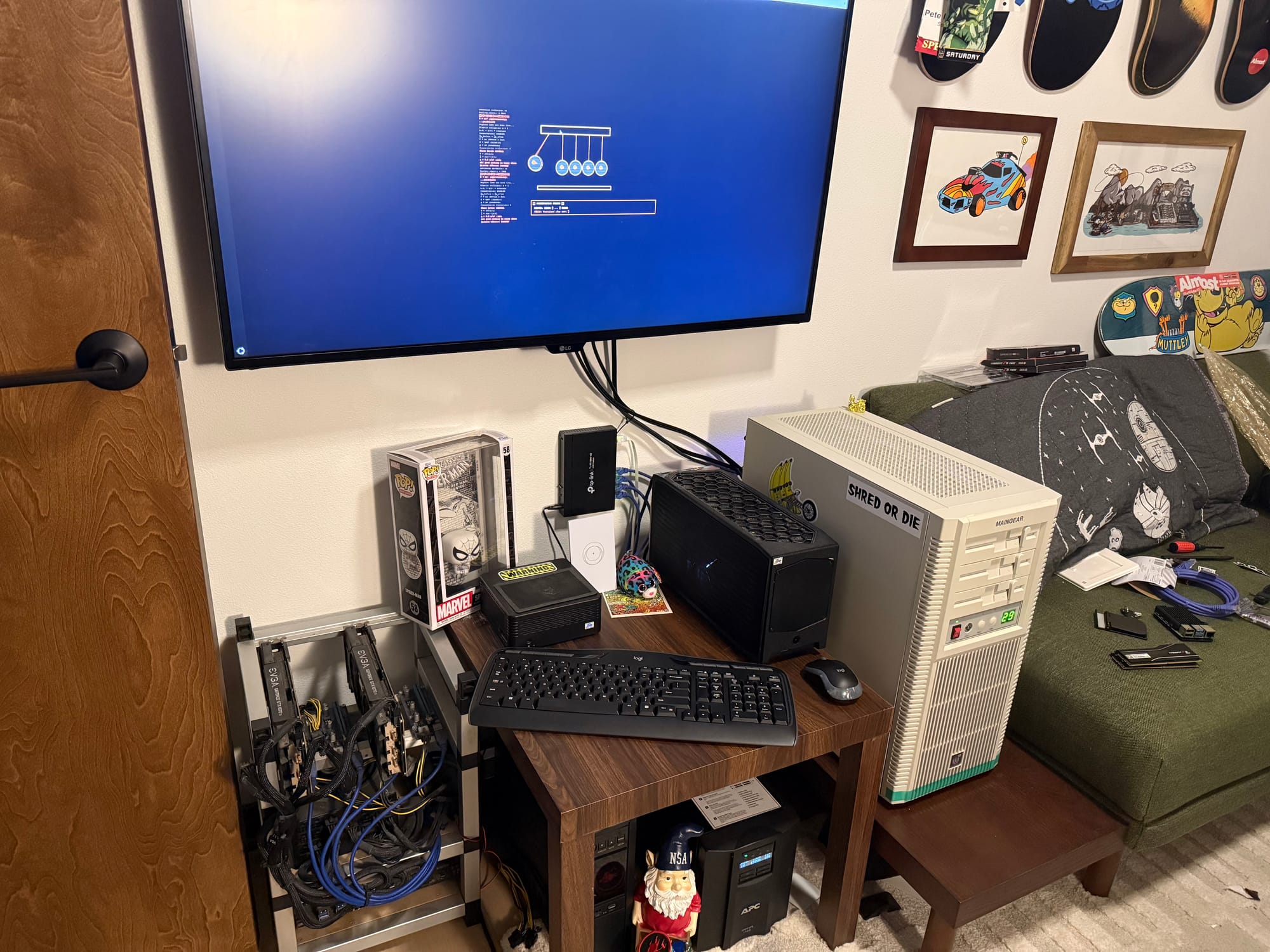 The setup. forge-1, lunchbox, beast, 43 inches of 4K, and a sticker that says SHRED OR DIE.